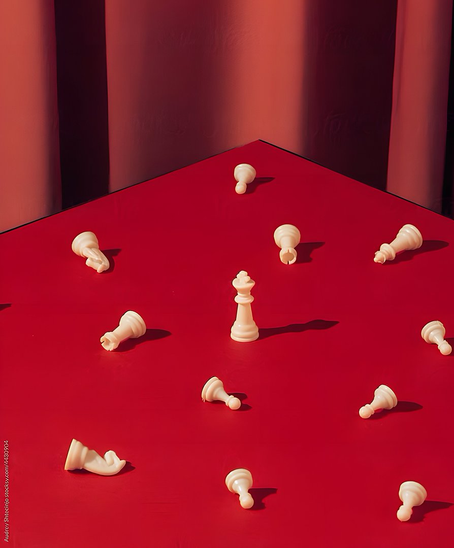 Chess pieces on a red surface